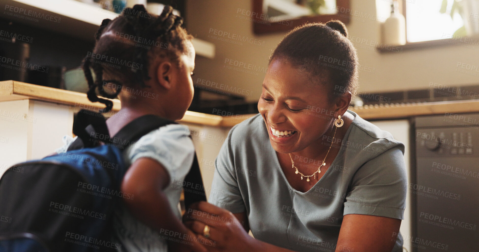 Buy stock photo Black woman, child and backpack for school, education, morning and support for childhood development. Mother, daughter and smile with affection, care and love in kitchen or home for bonding as family