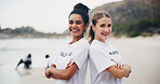 Volunteer team, woman and portrait on beach with arms crossed for cleaning, social responsibility or NGO project. Earth day, people and charity work for sustainability and eco friendly environment