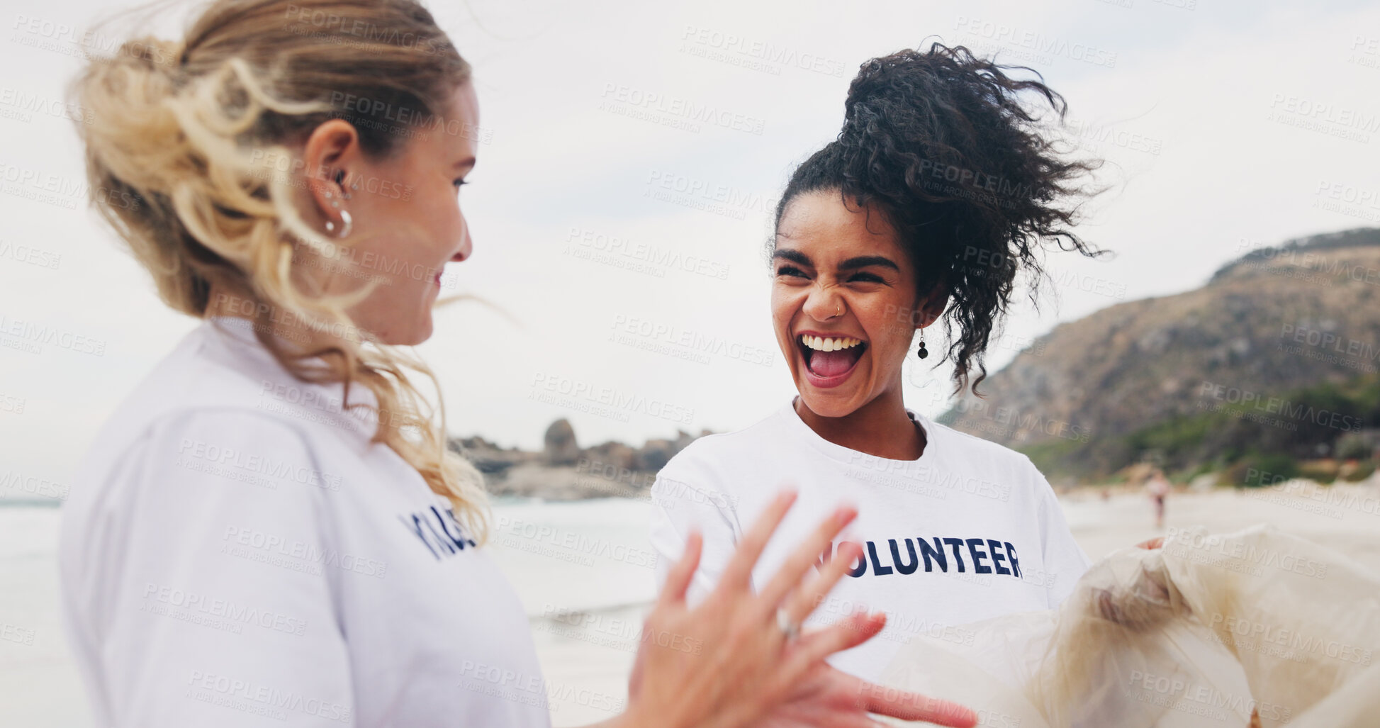 Buy stock photo Women, cleaning beach and volunteer with conversation, world earth day and kindness with care. Environment, seaside and friends with trash bag, collecting plastic and help with pollution from ocean