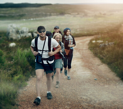 Buy stock photo A happy group of friends walking the hiking trails together