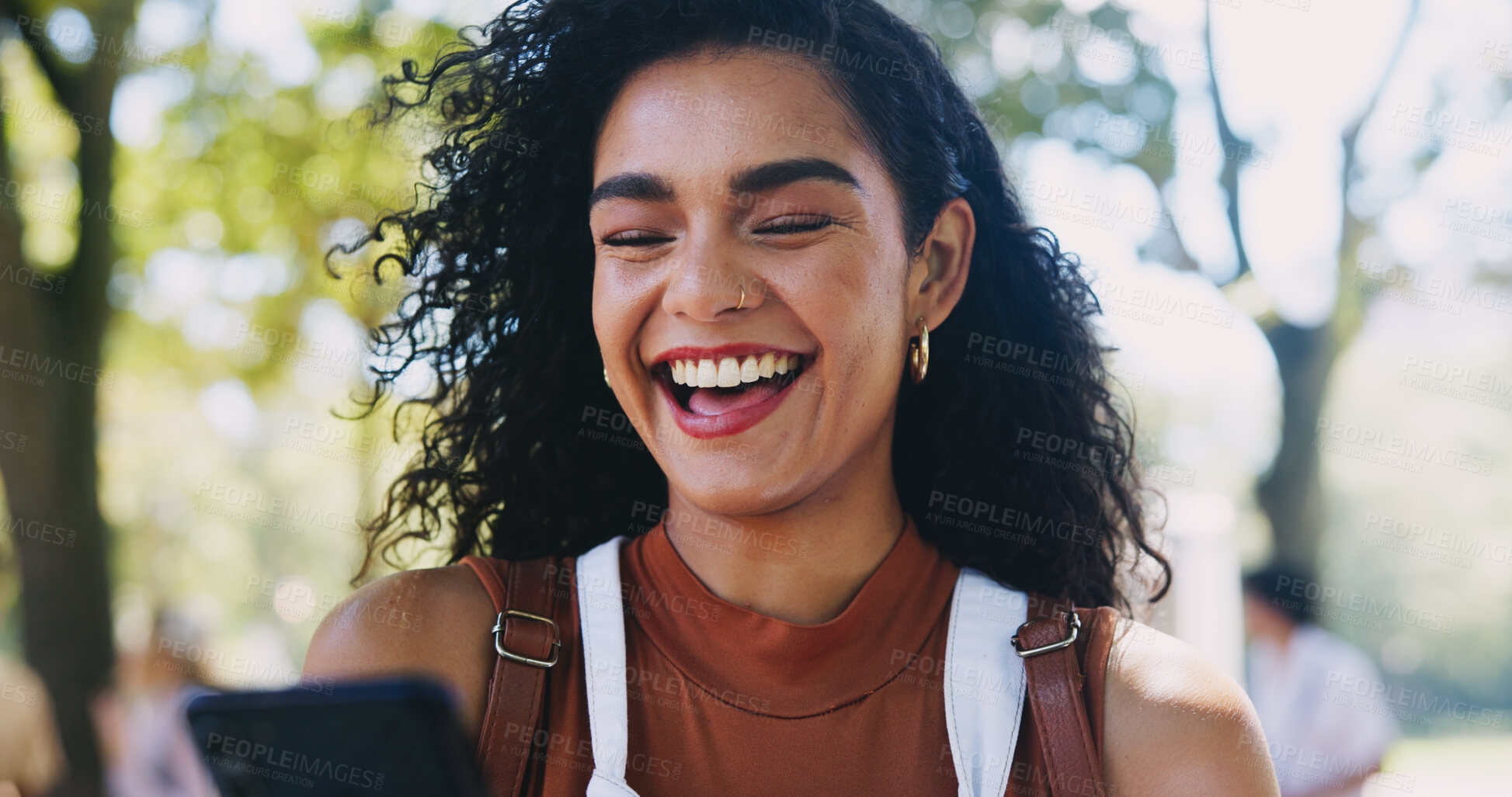 Buy stock photo Laughing, park or happy woman with phone in university for learning application, good news or education. Social media meme, pass or student with academic registration, scholarship or test results