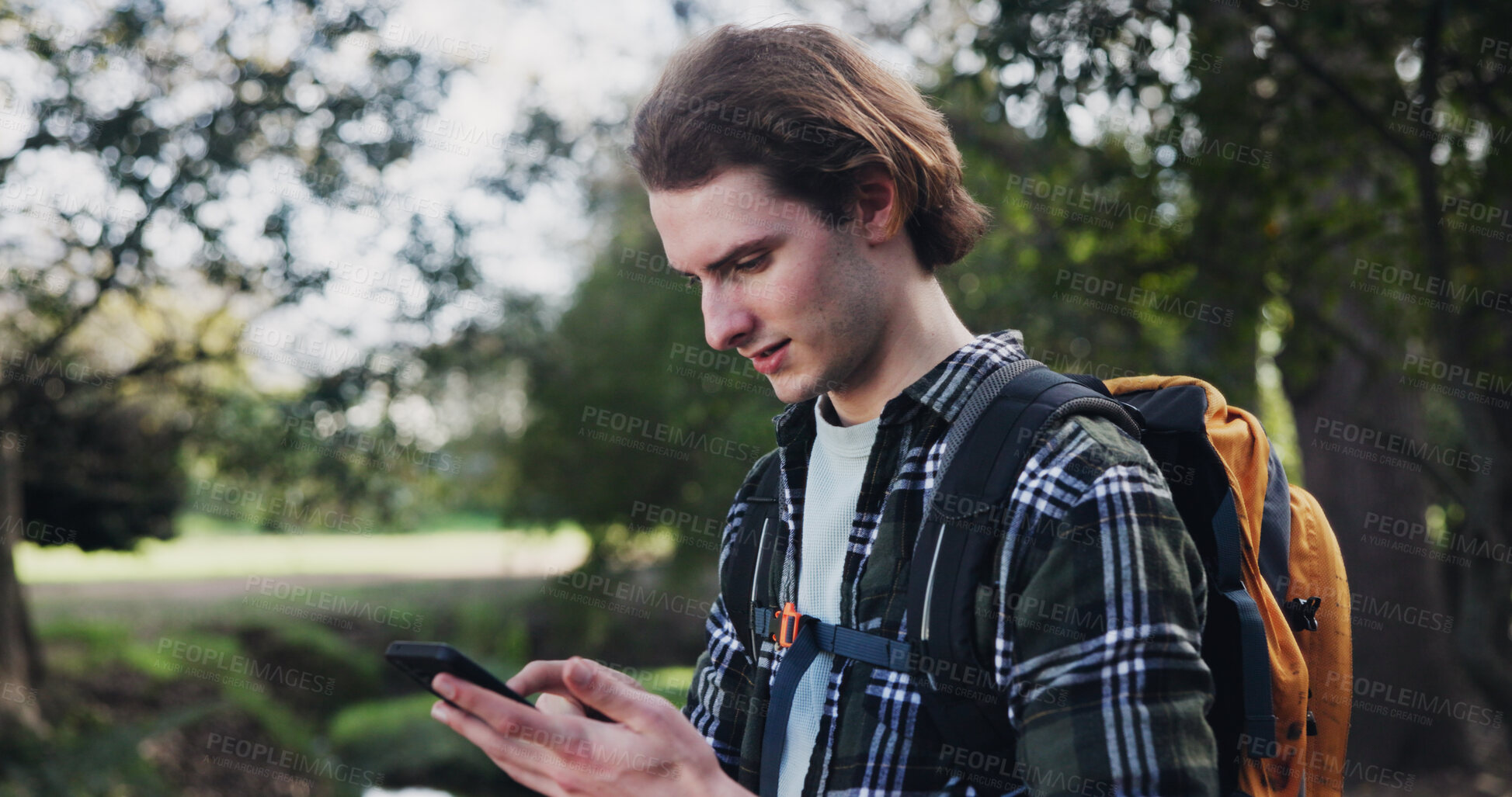 Buy stock photo Hiking, phone and man in nature for directions, navigation app and checking route on map. Lost, low signal and male tourist in woods with mobile, connectivity or location tracking error in wilderness