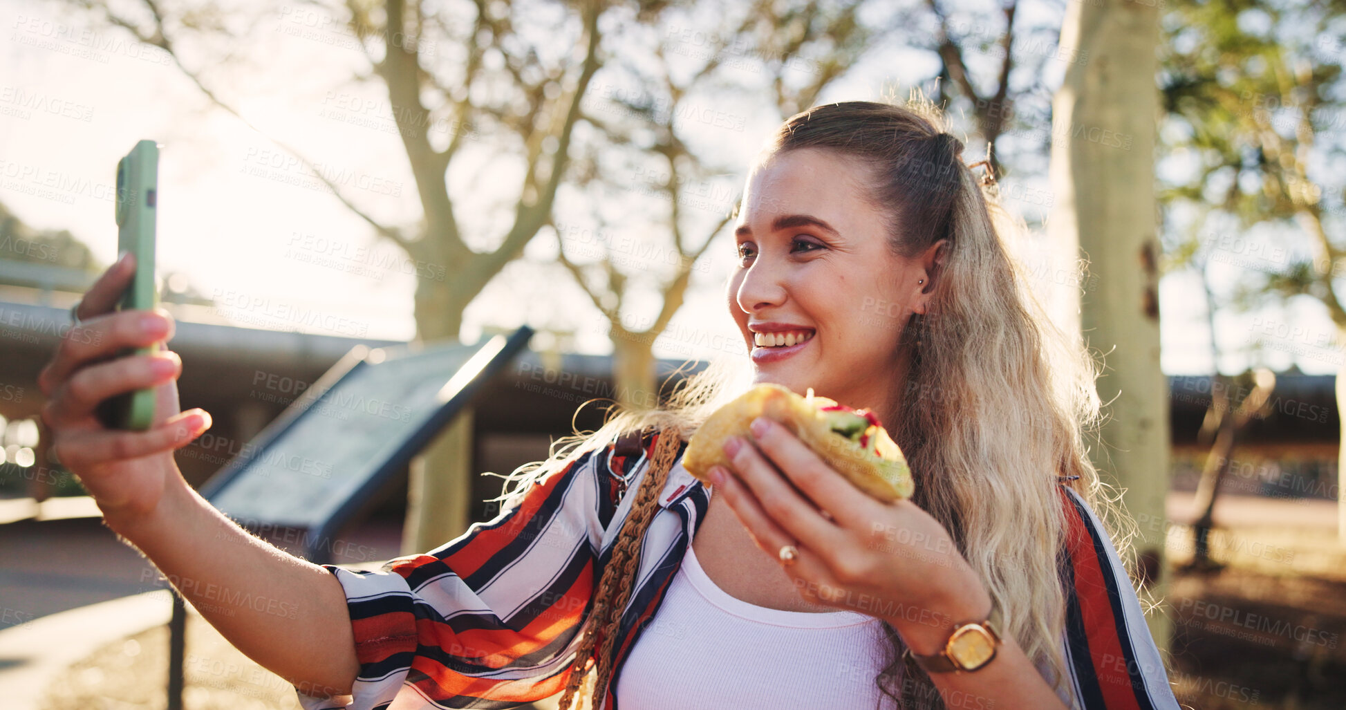 Buy stock photo Happy, selfie and woman with food in park for social media, online post and profile picture outdoors. Content creator, influencer and person take photo with taco for lunch, dinner and eating takeaway