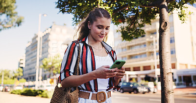 Buy stock photo Woman, phone and typing outdoor for social media, communication and travel while chatting with chat. Female person, smartphone and walking in city for networking, email and mobile app with message