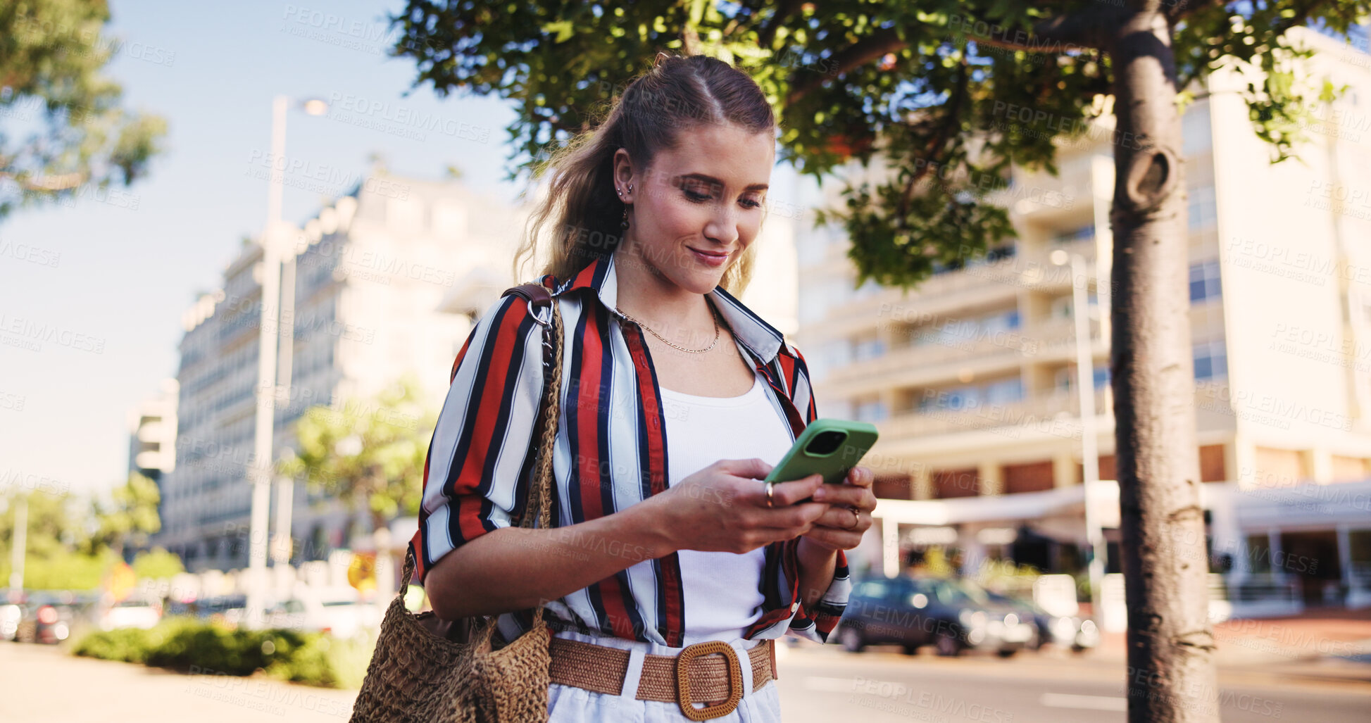 Buy stock photo Woman, phone and typing outdoor for social media, communication and travel while chatting with chat. Female person, smartphone and walking in city for networking, email and mobile app with message