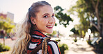 Woman, portrait and smile with travel in park for university, education and journey to campus. Happy, face and student with bag in nature for learning, development and morning commute in New York