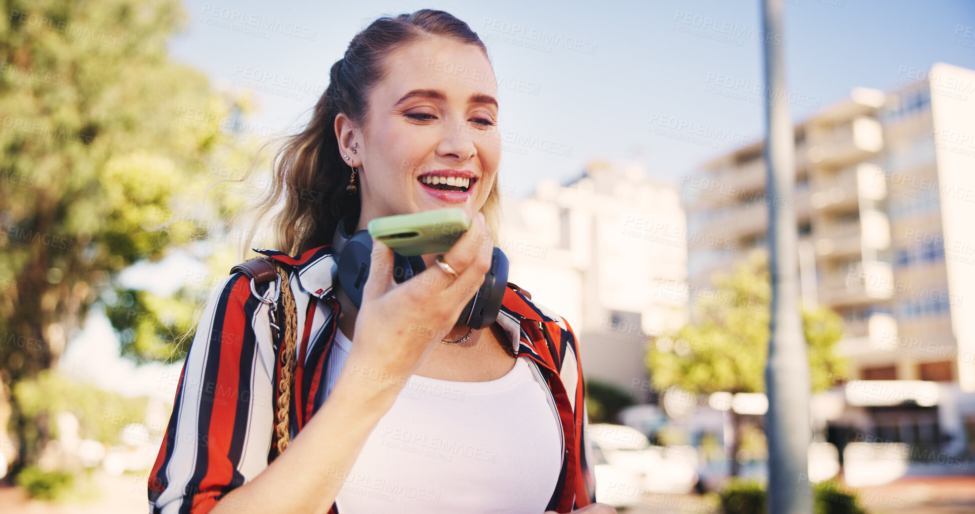 Buy stock photo Woman, smile and phone for audio recording, conversation and mobile call with speaker or microphone. Female person, smartphone and walking in city for networking and technology with voice recognition