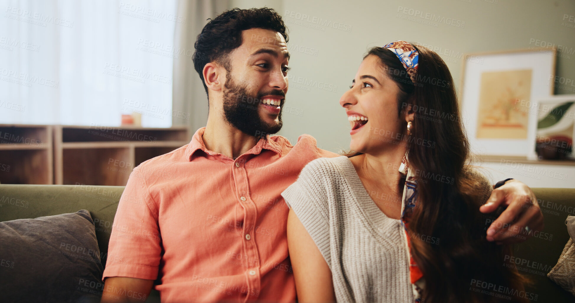 Buy stock photo Smile, love and excited couple on sofa in home together to relax with fun bonding, embrace and care. Man, woman and laughing on couch with support, comedy or happy relationship romance in living room