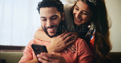 Buy stock photo Laugh, happy and couple on sofa with phone for bonding, loving relationship and relax together in home. Love, apartment and man and woman embrace on smartphone for social media, website and internet