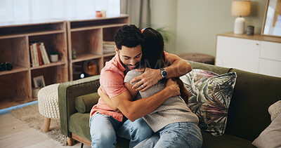 Buy stock photo Couple, hug and love on sofa in home with support, care and bonding with connection in relationship. Man, woman and embrace on couch in lounge with smile, relax and living room at house in Colombia