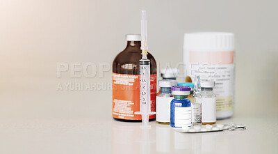 Buy stock photo Bottles of medicine, pills and a syringe or needle on a table for healthcare. Steroids, medical equipment and supplements together for bodybuilder muscle growth or prevention for sickness or disease