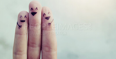 Buy stock photo Cropped shot of fingers with smileys drawn on them