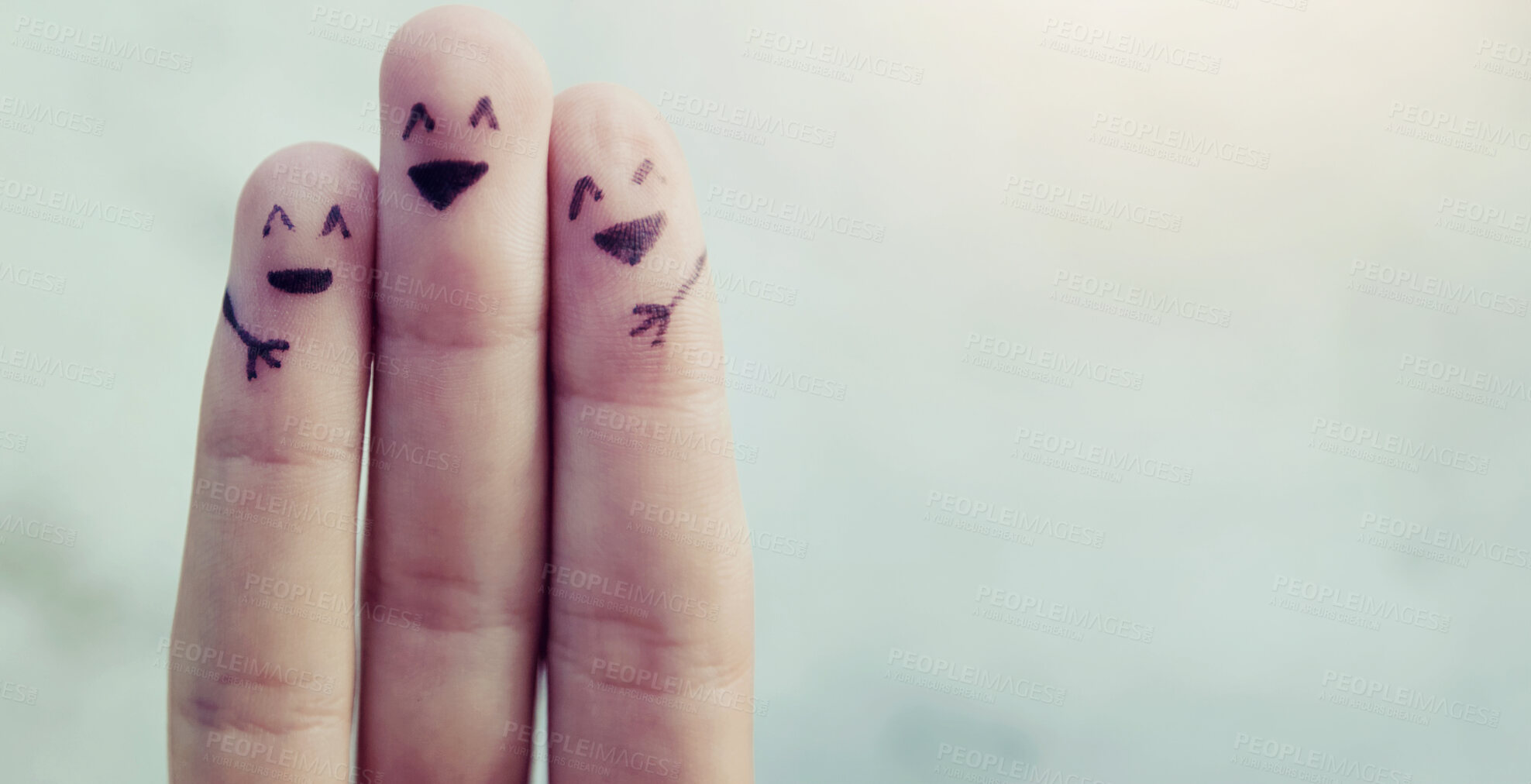 Buy stock photo Cropped shot of fingers with smileys drawn on them