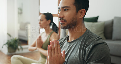 Buy stock photo Couple, man and namaste with meditation on floor for holistic wellness, mindfulness and relax in home with zen. People, praying hands and spiritual healing in living room for yoga, pilates or bonding