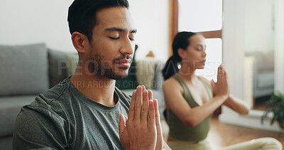 Buy stock photo Couple, man and namaste with meditation in home for holistic wellness, mindfulness and relax on floor with zen. People, praying hands and spiritual healing in living room for yoga, pilates or bonding