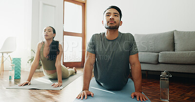 Buy stock photo Yoga, couple and stretching in home for calm, wellness and spiritual healing. Man, woman and cobra pose in pilates for healthy body, activity in relationship and positive mental health in living room