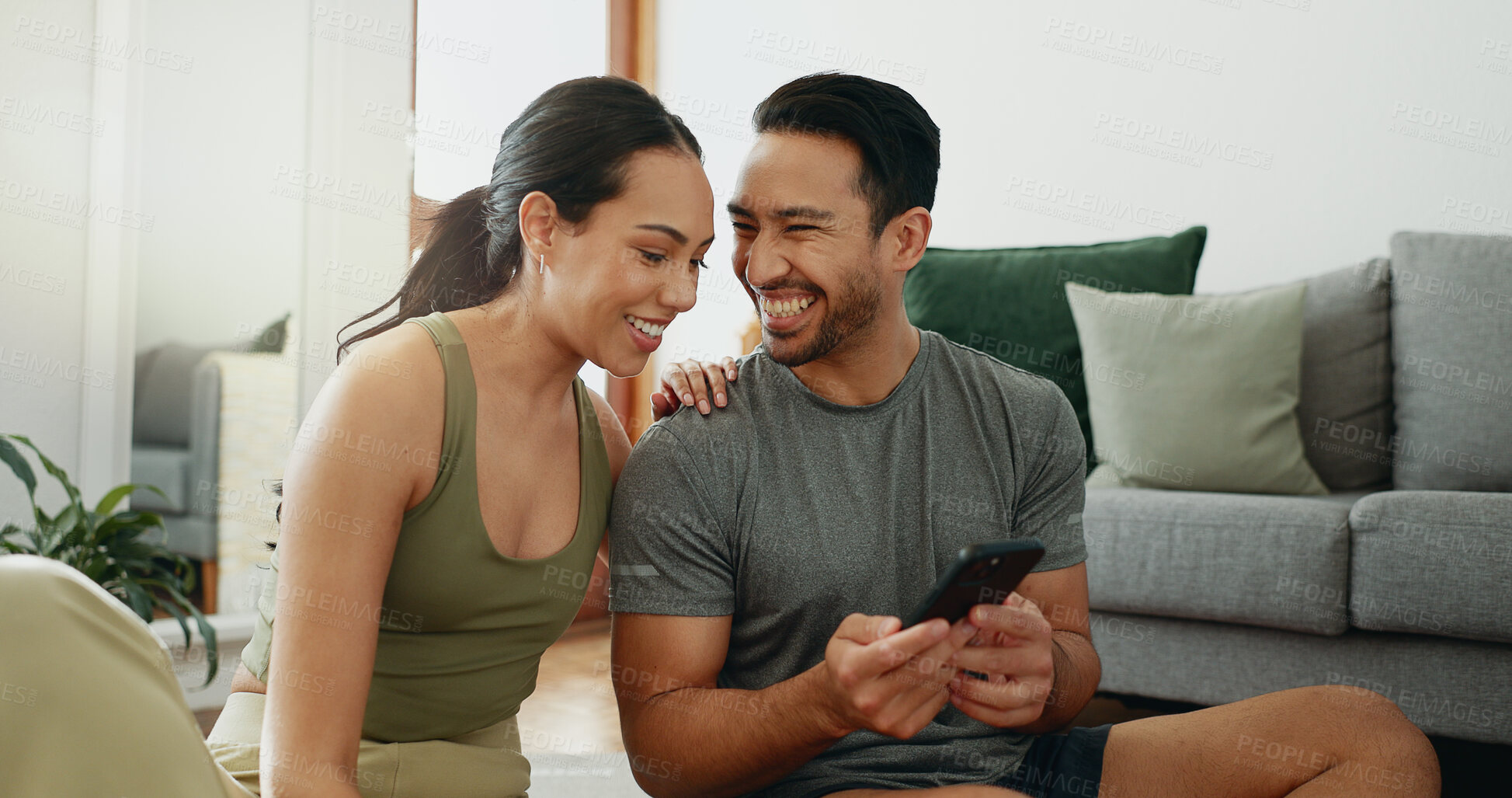 Buy stock photo Funny, phone and happy couple talking in home for social media, meme or reading message. Man, woman and laugh with mobile in living room for conversation, comedy or watch video on internet together