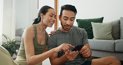 Buy stock photo Online shopping, phone and happy couple talking in home for social media, choice and payment. Man, woman and mobile in living room for conversation, account review and check credit score on internet