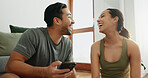 Laughing, phone and happy couple in home for funny meme, comedy or comic. Man, woman and joke with mobile in living room for conversation or watch video on internet together on social media platform