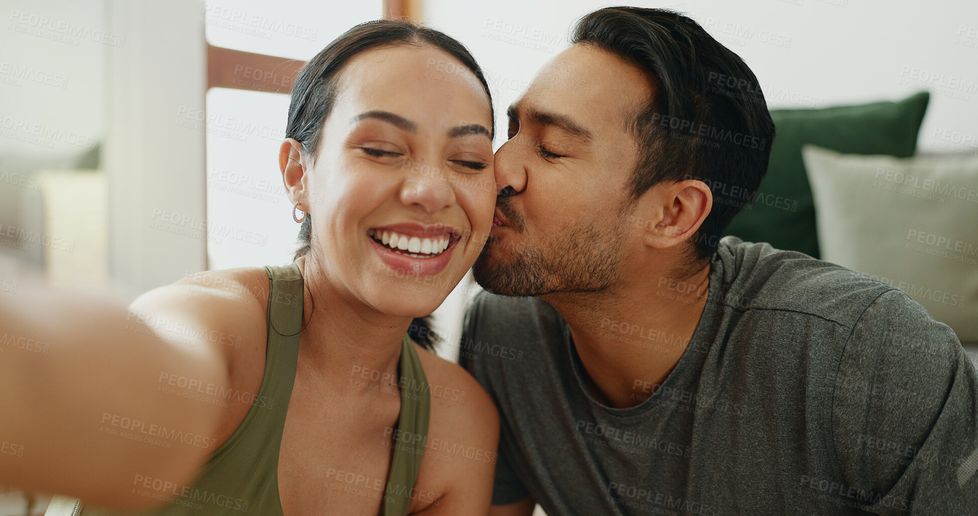 Buy stock photo Selfie, happy and couple on sofa kiss for bonding, relationship and relax together in home. Dating, new house and face of man and woman take photo for profile picture, social media and online post