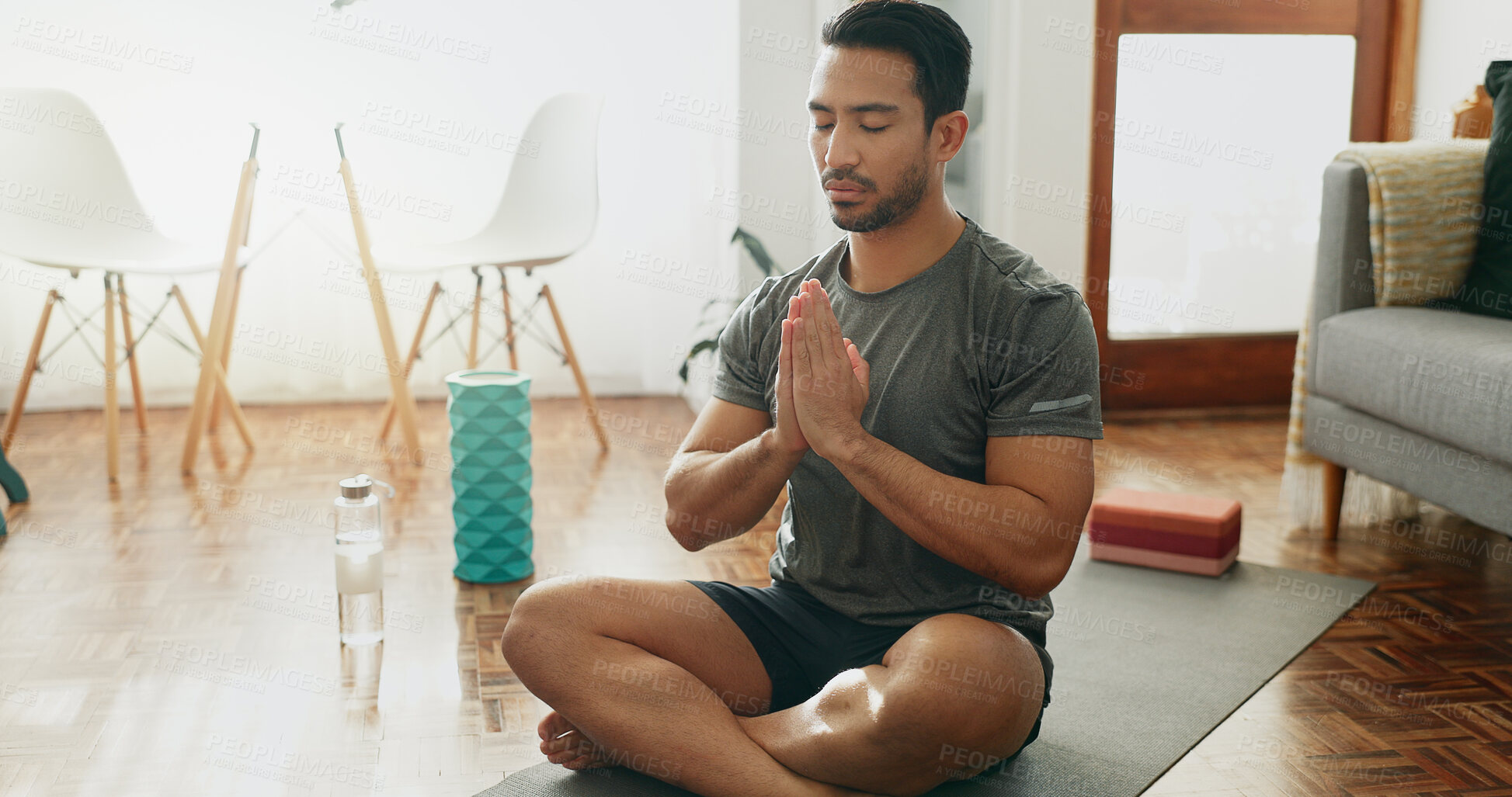 Buy stock photo Calm man, meditation and namaste with mat for yoga, fitness or awareness on floor at home. Young male person or yogi in relax, stress relief or exercise for zen, inner peace or mindfulness at house