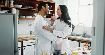 Buy stock photo Couple, happy and love in kitchen with smoothie, healthy breakfast or fun in relationship. Man, woman and drink in home for nutrition, bonding and relax in morning or excited for anniversary or trust