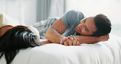 Buy stock photo Happy couple, relax and morning with bed for bonding, love or support together in pajamas at home. Young man and woman with smile, care and enjoying weekend, holiday or lazy day in bedroom at house