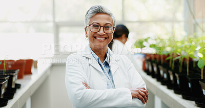 Buy stock photo Woman, scientist and arms crossed in greenhouse for portrait with smile, pride and research for agriculture. Mature person, container and chemistry for study, development and assessment in Indonesia