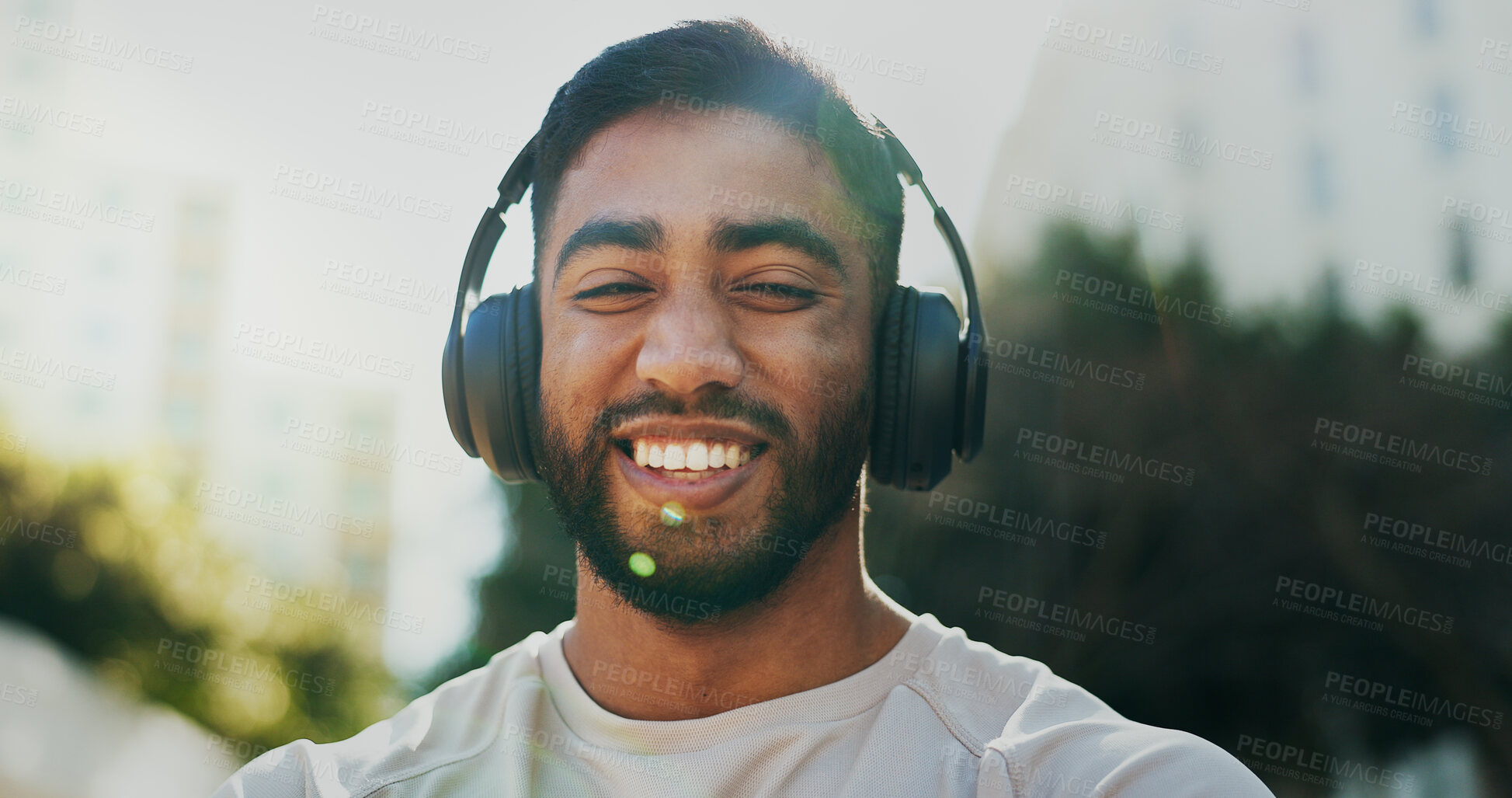 Buy stock photo Fitness, headphones and portrait of man in city for running, workout or training for race endurance. Smile, sports and male athlete with audio tech for podcast, music or radio with cardio exercise.