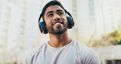 Buy stock photo Man, thinking and city with headphones for listening, audio streaming or music in an urban town. Young male person in wonder for outdoor inspiration or dream with headset for sound, podcast or radio