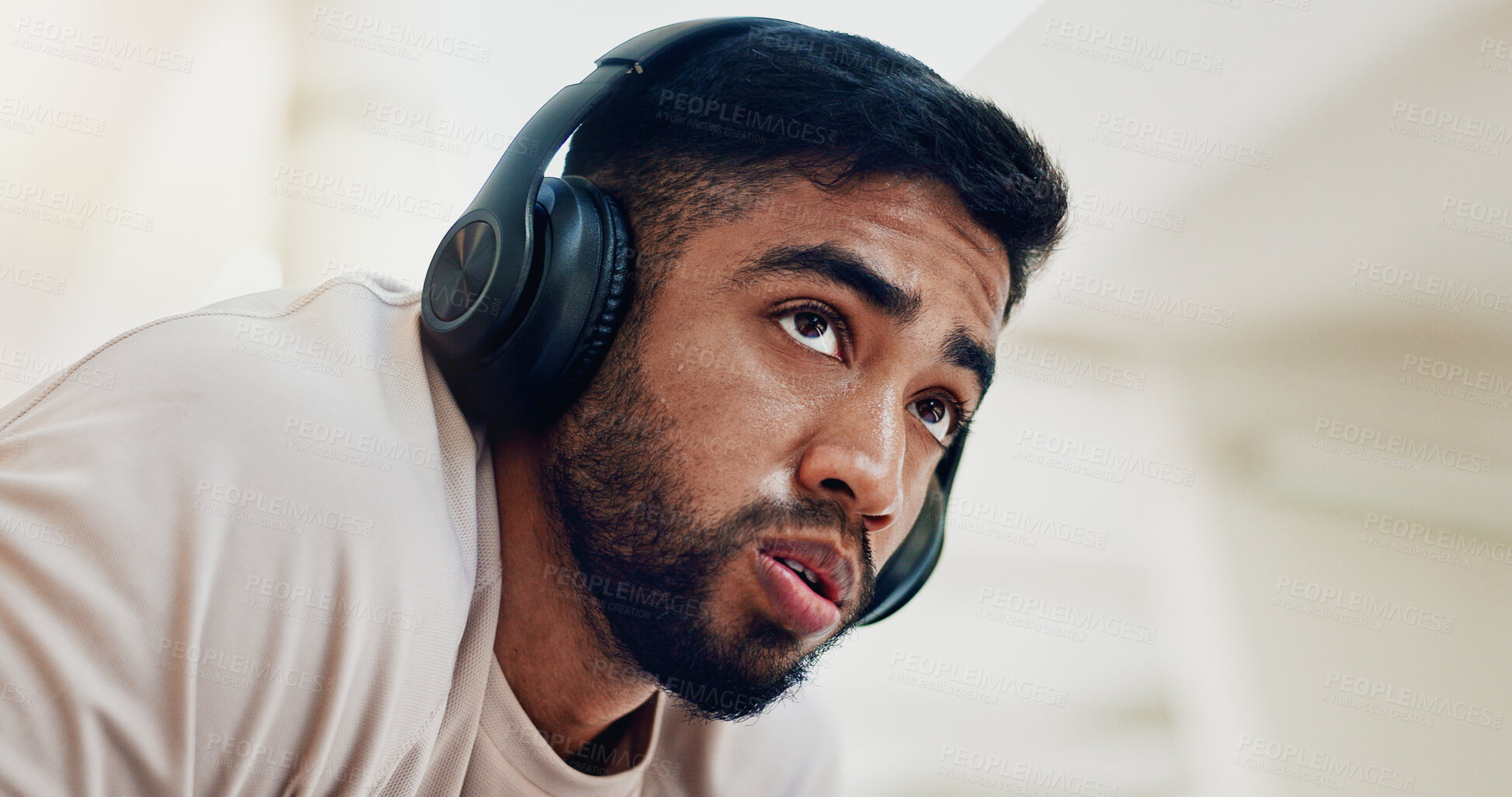 Buy stock photo Thinking, headphones and man with fitness, burnout or fatigue with sound, listening to music or calm. Person, runner or athlete with headset, exhausted or song for motivation, exercise goals or tired