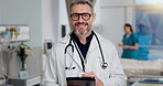 Portrait, doctor and typing on tablet at clinic for Telehealth consultation, healthcare charts and medical. Man, digital and review surgery schedule, diagnosis report and prescription information