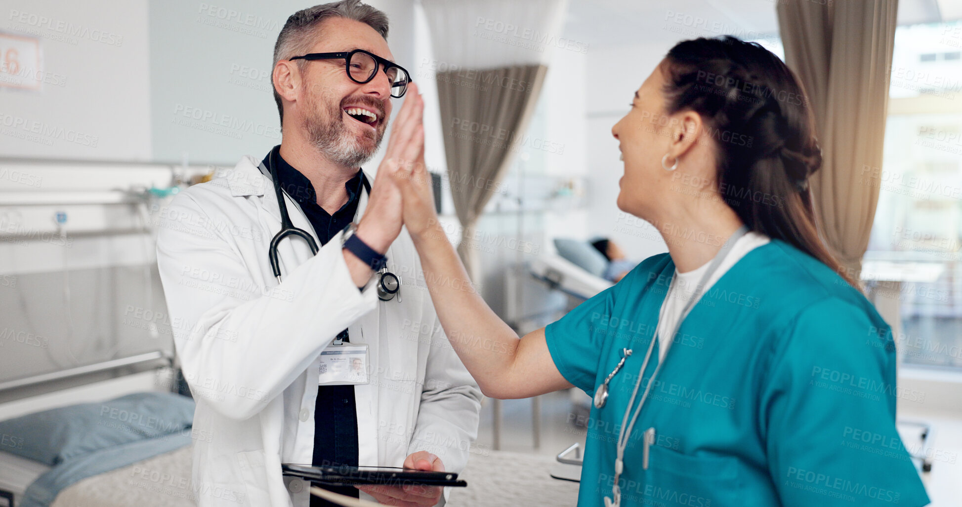 Buy stock photo High five, doctor and nurse in hospital room, smile and happy with results of diagnosis and teamwork. Tablet, people and collaboration for research, hands and thank you for help in healthcare