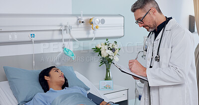 Buy stock photo Clipboard, bed and doctor with woman in hospital for healthcare, consultation or cardiology service. Medical chart, discussion and cardiologist with patient for postoperative checkup in clinic.