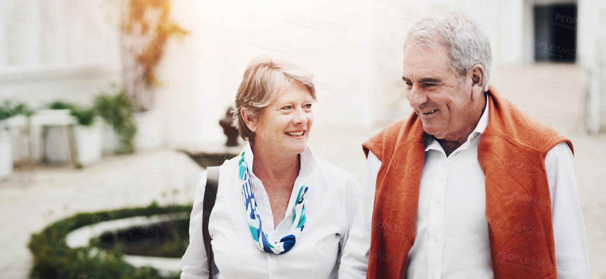 Buy stock photo Happy, talking and a senior couple in the city for a retirement holiday, travel and happiness. Smile, love and an elderly man and woman walking in an old town or hotel during a vacation together