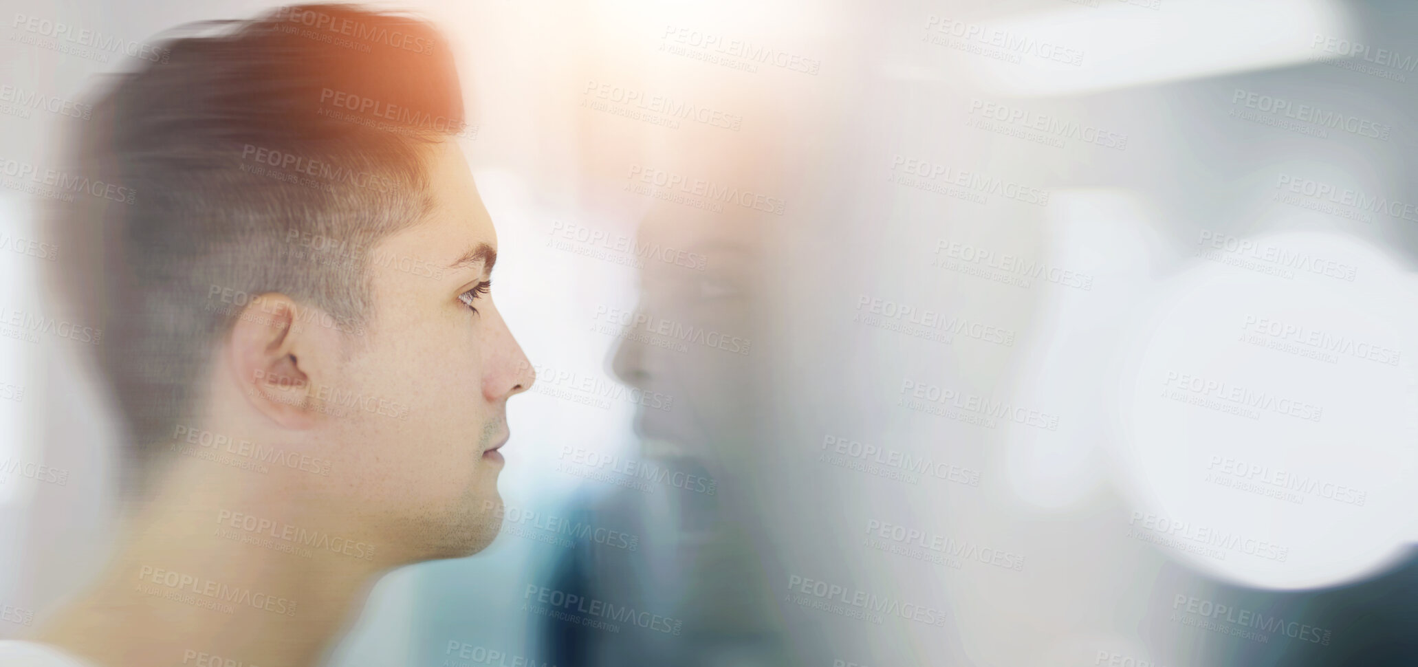 Buy stock photo Young man looking at a screaming reflection of himself