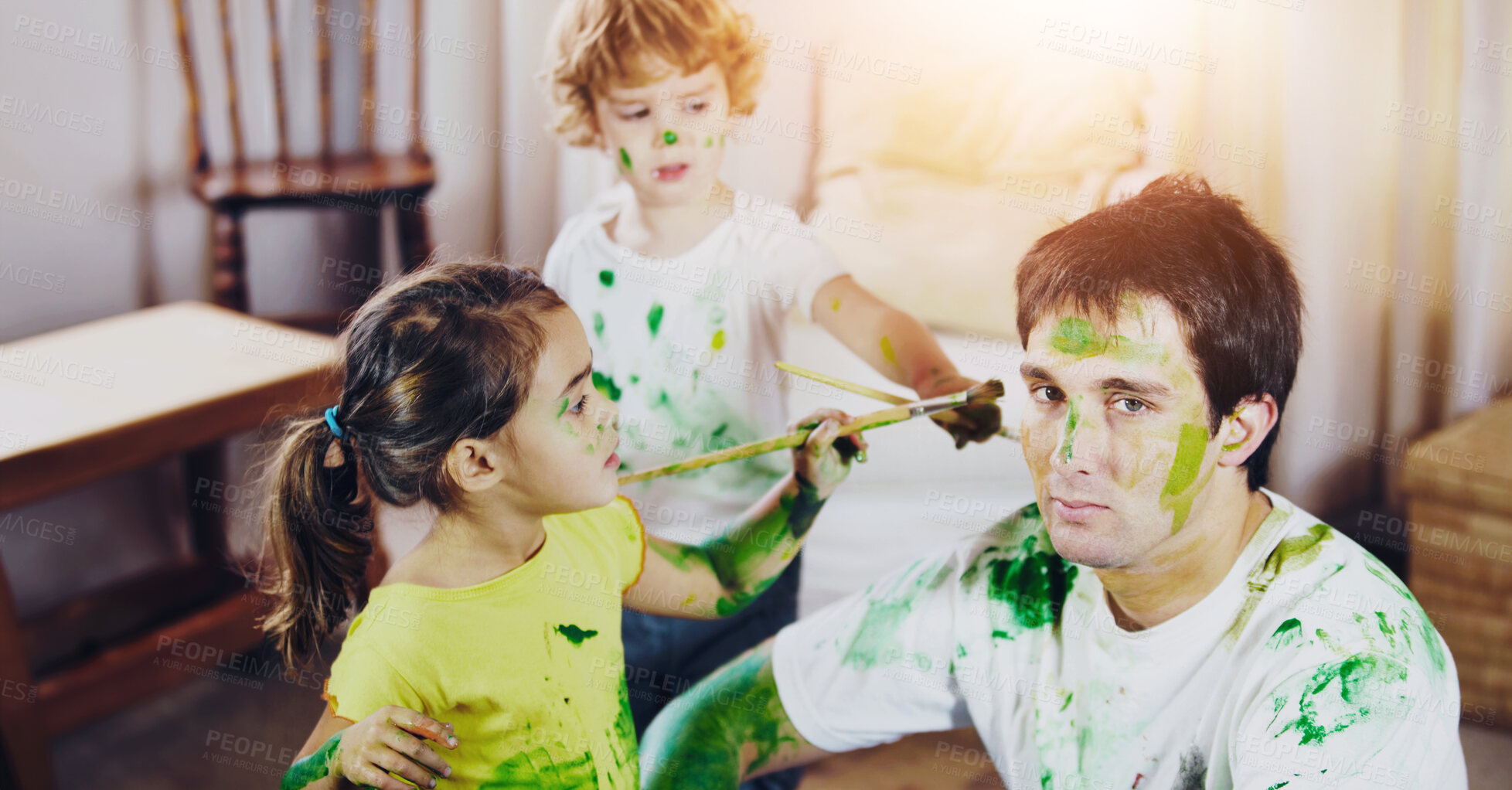 Buy stock photo Shot of a dad being painted by his children