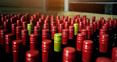 Buy stock photo Closeup of many red wine bottles in a box at a bottling factory. Lots of unopened red wines at warehouse ready for distribution to wine selling business. Bulk bottle collection in winemaking industry