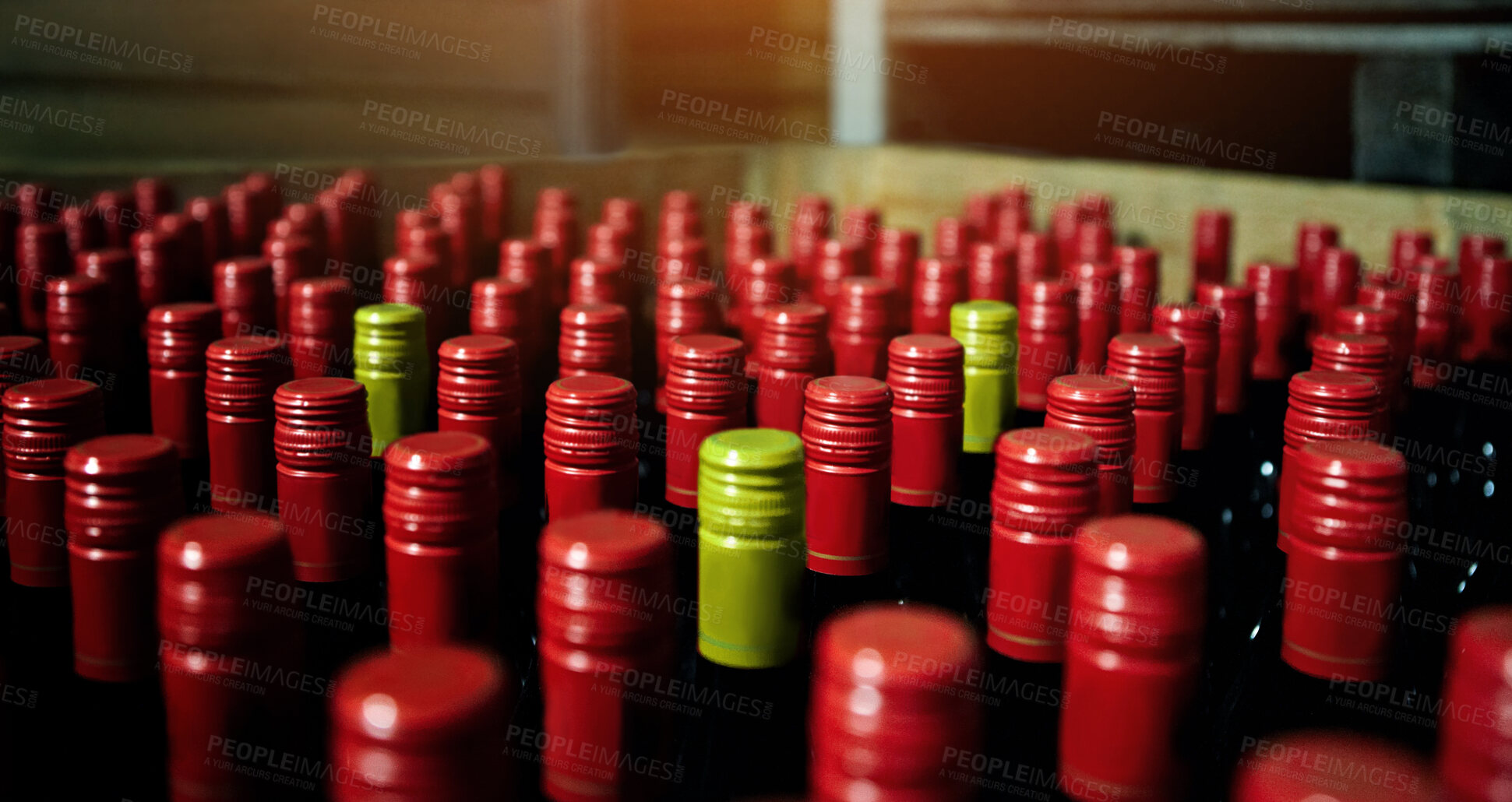 Buy stock photo Closeup of many red wine bottles in a box at a bottling factory. Lots of unopened red wines at warehouse ready for distribution to wine selling business. Bulk bottle collection in winemaking industry