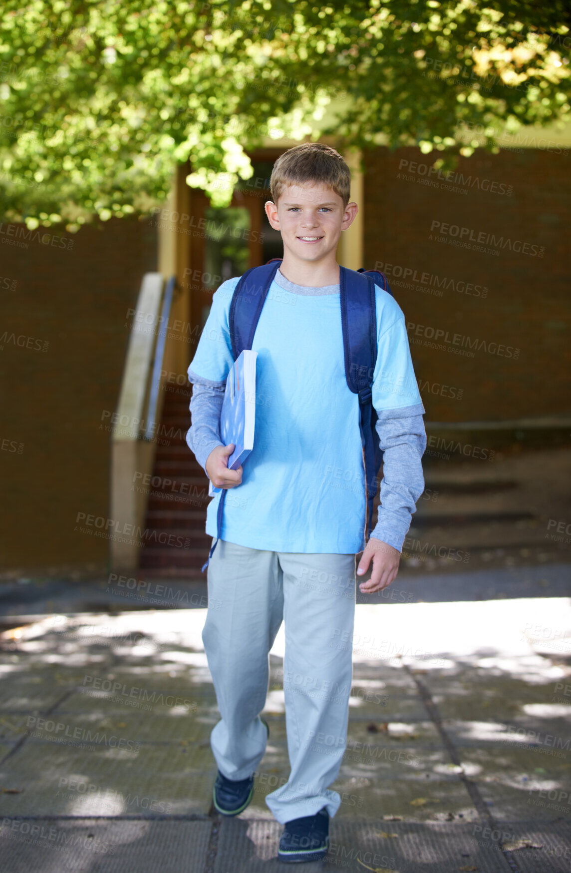 Buy stock photo Portrait, boy and book with backpack, outdoor and smile with knowledge, education and happy. Person, outside and student with childhood development, bag and kid with joy, cheerful and learning