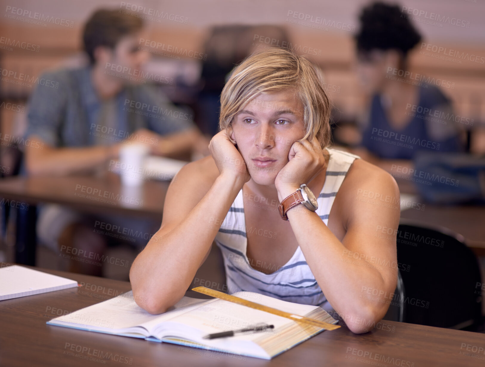 Buy stock photo Man, student and bored with book for studying, education or learning in library or classroom at college. Distracted young male person or learner with study notes or textbook for literature or reading