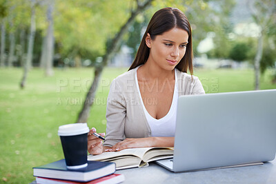 Buy stock photo Student, books and coffee with laptop in park, technology and education by table for studying. College, young woman and commitment with outdoor by tea, focus and writing notes with online connection