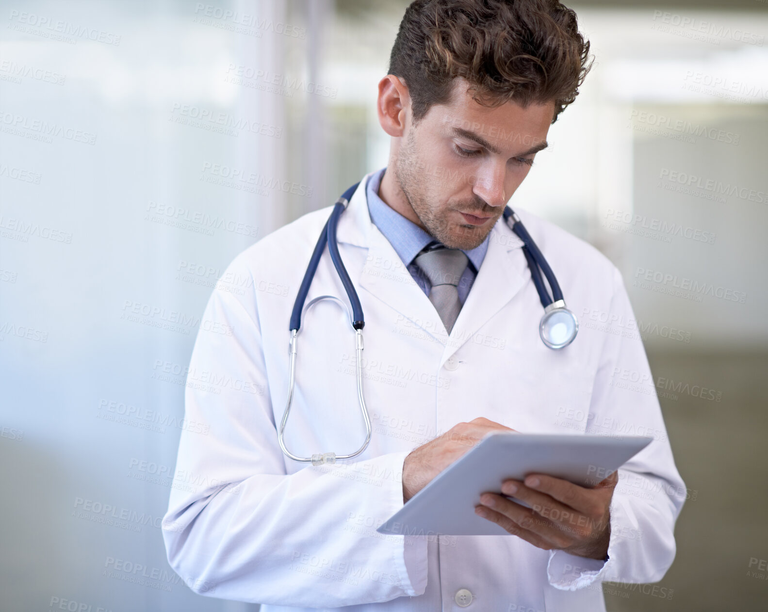 Buy stock photo Cropped shot of a handsome young doctor