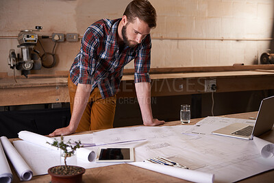 Buy stock photo Man, review blueprint and architect with engineering or construction, renovation project and design for building. Floor plan, sketch and property development with assessment of paperwork in workshop