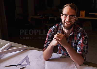 Buy stock photo Portrait, confident and architect with paperwork in workshop with smile for career in construction industry. Man, contractor and entrepreneur of startup, small business and design for planning