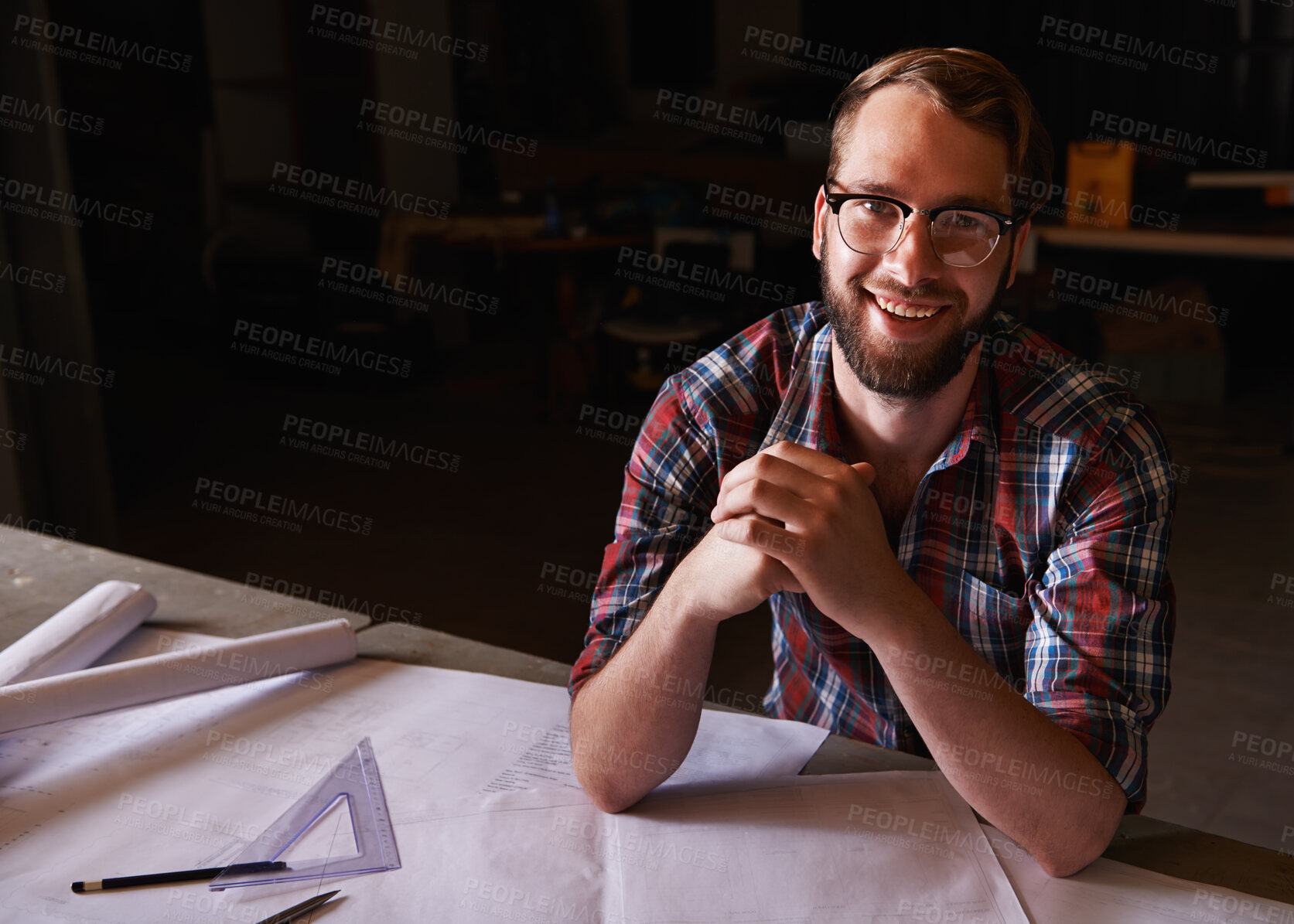 Buy stock photo Portrait, confident and architect with paperwork in workshop with smile for career in construction industry. Man, contractor and entrepreneur of startup, small business and design for planning