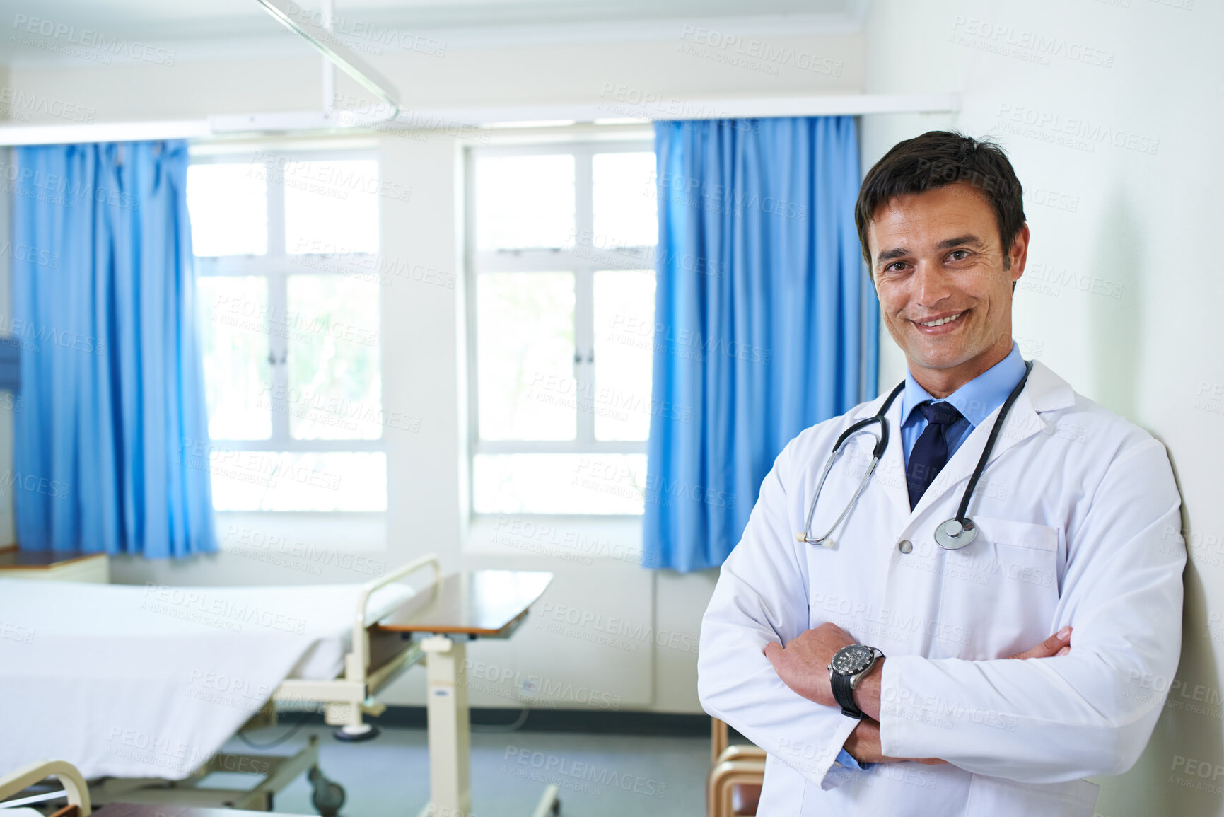 Buy stock photo Portrait, doctor and man with arms crossed, expert and happy to help in hospital, proud and smile. Clinic, medical professional and confident person, healthcare with orthopedic surgeon or employee