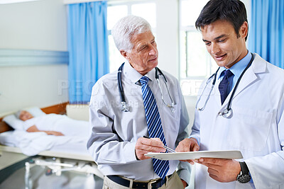 Buy stock photo Doctors, team and men in discussion with chart or results for sick patient in clinic. Healthcare, medical professional or collaboration with checklist for advice, planning or help with mature mentor