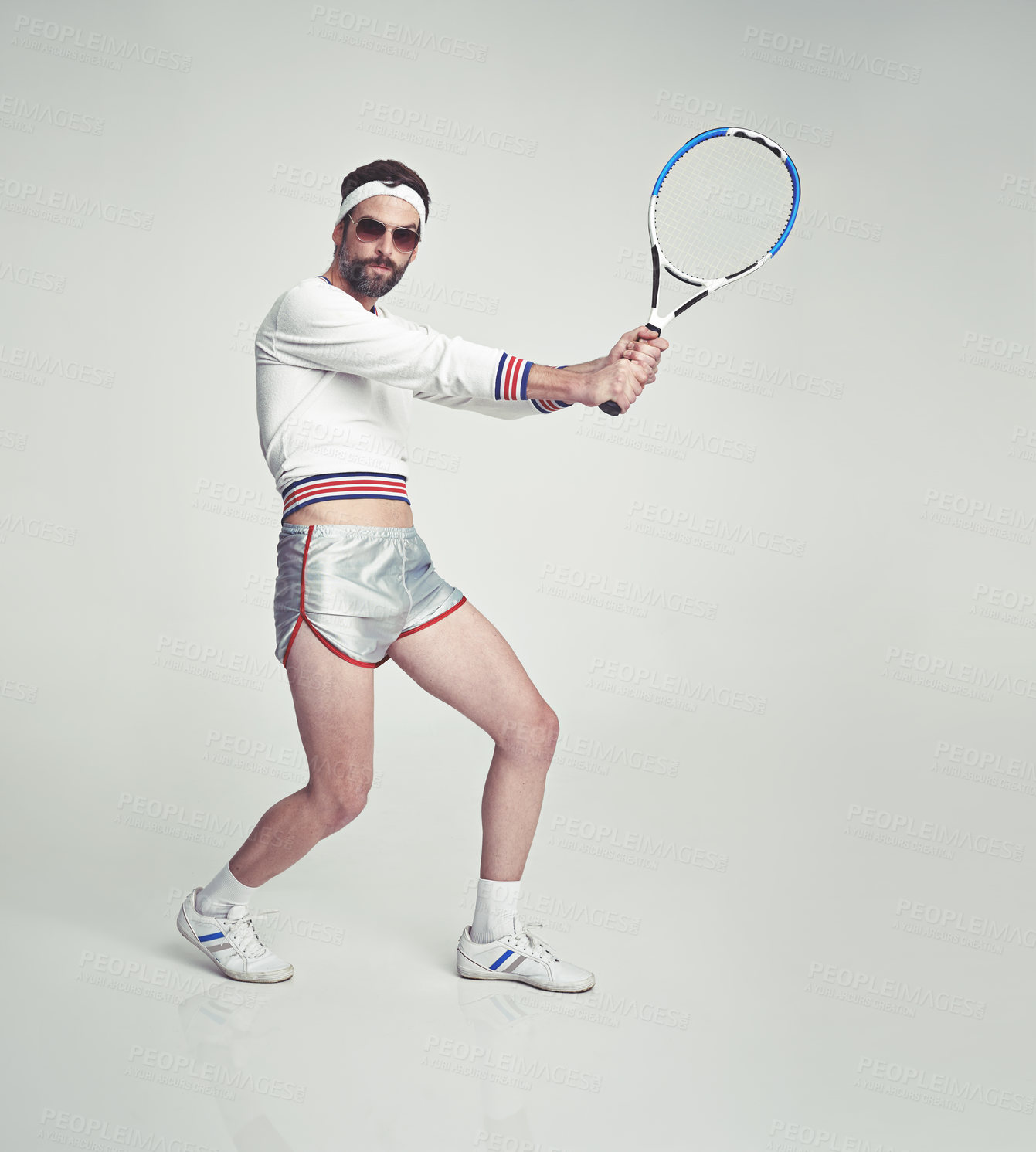 Buy stock photo Portrait, man and retro as tennis player with racket, outfit and confidence on studio background. Male person, style and sportswear for vintage fashion, game or challenge in fitness, wellness or pose