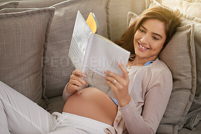 Buy stock photo Woman, happiness and pregnancy book on couch for research, planning and portrait in living room for baby. information, studying and learning in family home for development, growth and health guide